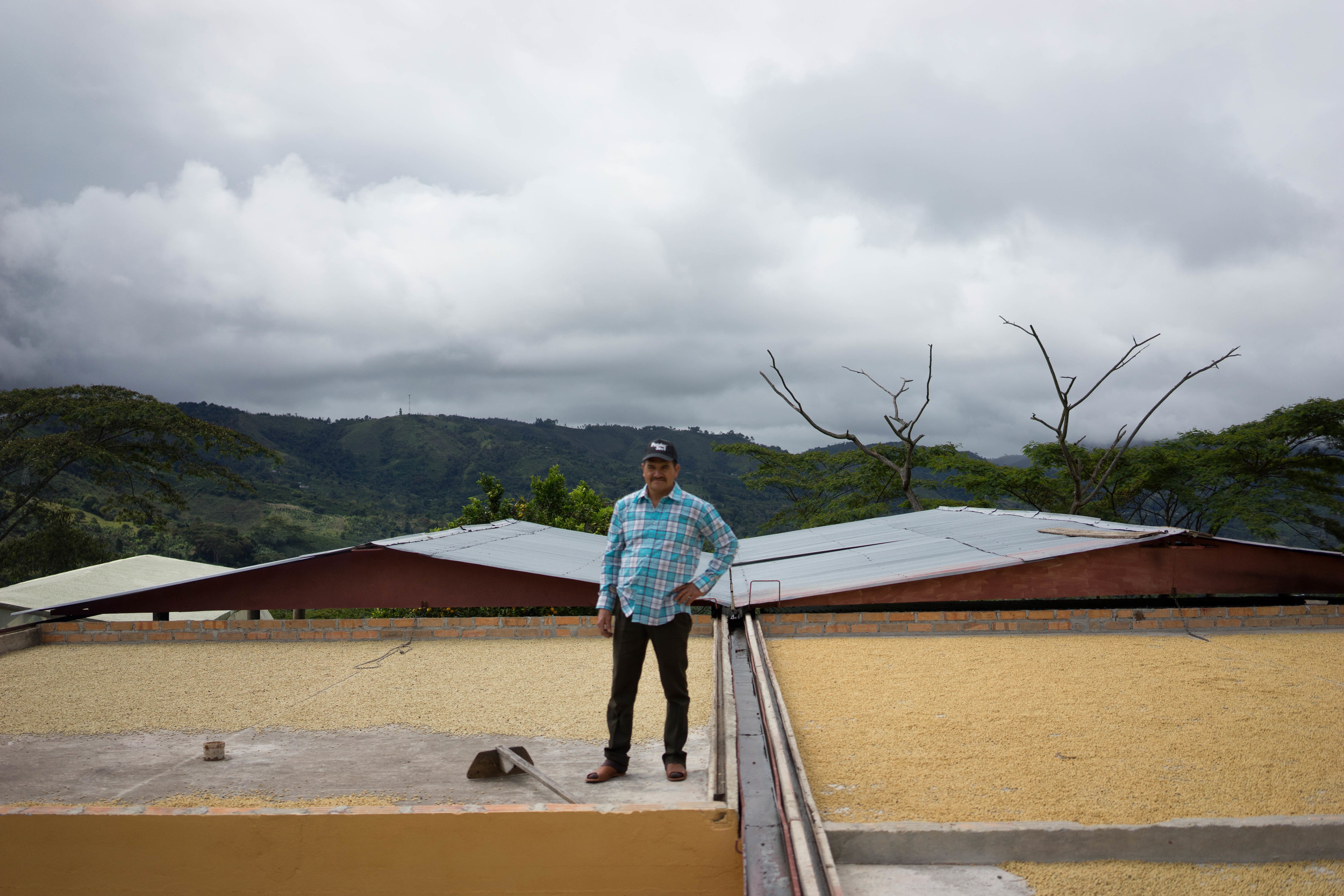 Alfredo Baos in Palestina, Huila, proudly showing us his coffee